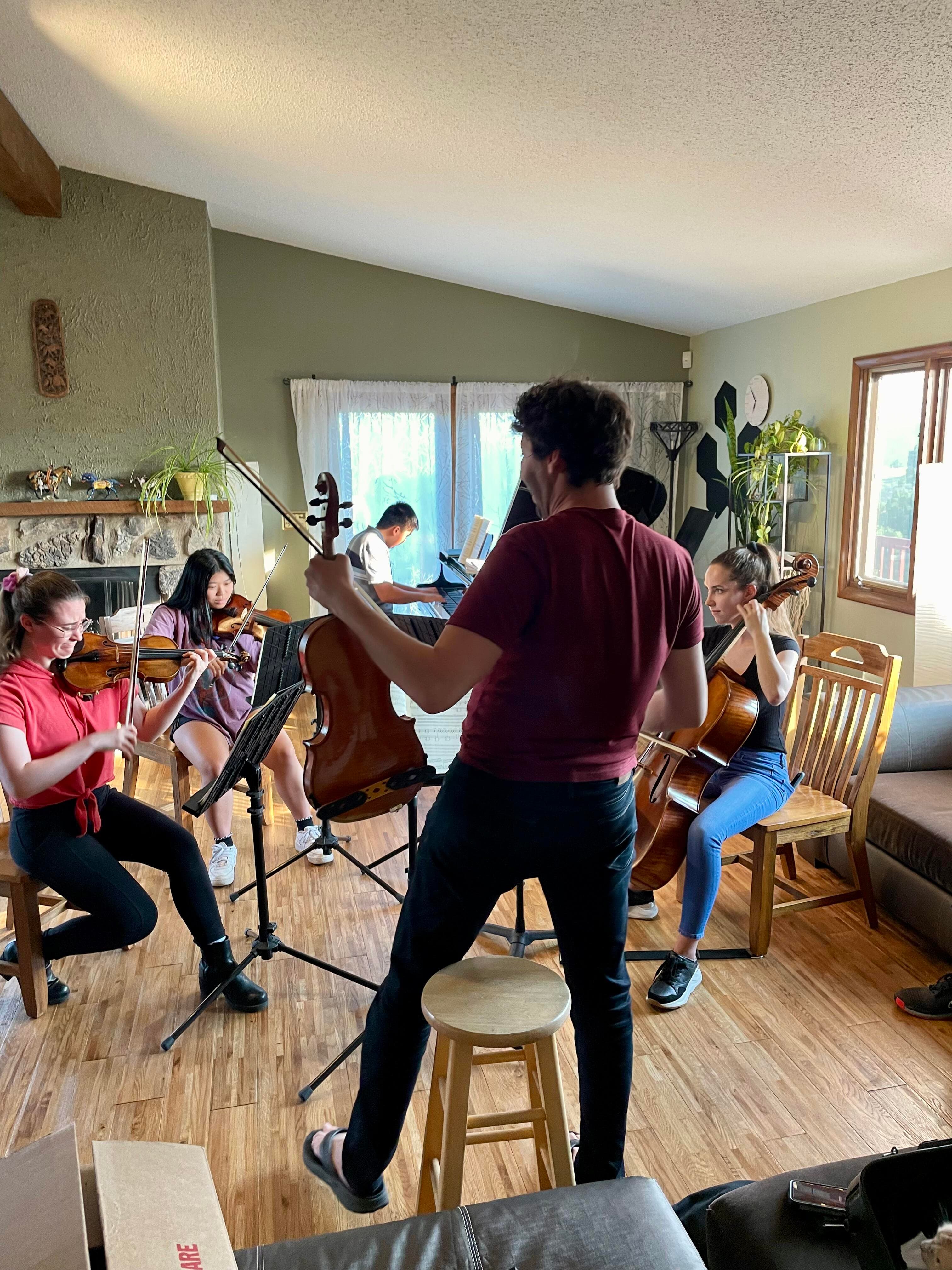 Dr. Brett Walfish teaching a violin lesson
